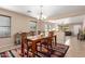 Inviting dining room with a wooden table, chandelier, and decorative rug at 749 E Desert Moon Trl, San Tan Valley, AZ 85143