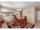 Warm dining room with open access to the living area, perfect for entertaining at 749 E Desert Moon Trl, San Tan Valley, AZ 85143