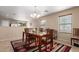 Inviting dining room with a wooden table, chandelier, and decorative rug at 749 E Desert Moon Trl, San Tan Valley, AZ 85143