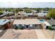 An aerial view of the home, featuring a private pool and well-kept gravel yard at 7513 E Roosevelt St, Scottsdale, AZ 85257