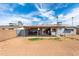 Backyard with covered patio and mature palm trees at 7513 E Roosevelt St, Scottsdale, AZ 85257