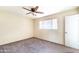 Bedroom featuring neutral walls, plush carpet, and a ceiling fan at 7513 E Roosevelt St, Scottsdale, AZ 85257