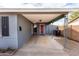 Open carport area with a covered walkway leading to the front door at 7513 E Roosevelt St, Scottsdale, AZ 85257