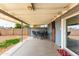 Spacious covered patio for outdoor dining and relaxation, with access to the backyard at 7513 E Roosevelt St, Scottsdale, AZ 85257
