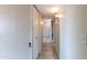Hallway with neutral walls and tile flooring leading to the living area at 7513 E Roosevelt St, Scottsdale, AZ 85257
