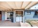 Covered outdoor laundry area with modern washer and dryer hookups for added convenience at 7513 E Roosevelt St, Scottsdale, AZ 85257