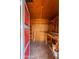 Inside view of a well-organized storage shed with shelving and ample space at 7513 E Roosevelt St, Scottsdale, AZ 85257