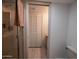 Bright bathroom featuring a glass shower and closet with bifold doors at 7811 N 46Th Ave, Glendale, AZ 85301
