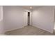 Bedroom featuring closet with bifold doors, new paint, and modern flooring at 7811 N 46Th Ave, Glendale, AZ 85301