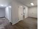 Spacious entryway featuring wood-look floors and access to multiple rooms in the home at 7811 N 46Th Ave, Glendale, AZ 85301