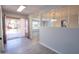 Bright entryway with wood-look floors and a view into the open-concept living area of the home at 7811 N 46Th Ave, Glendale, AZ 85301