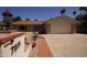 Attractive single-story home with a well-maintained lawn and mature palm trees, offering a welcoming curb appeal at 7811 N 46Th Ave, Glendale, AZ 85301
