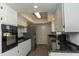 Bright kitchen with white cabinets, stainless steel appliances, and granite countertops at 7811 N 46Th Ave, Glendale, AZ 85301