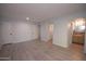 Open living room with wood-look floors near bedroom doors and bathroom at 7811 N 46Th Ave, Glendale, AZ 85301