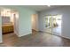 Spacious room with wood-look floors and sliding glass doors to backyard patio at 7811 N 46Th Ave, Glendale, AZ 85301