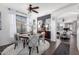 Cozy dining area featuring a round table, stylish chairs, and elegant decor with easy access to the living room at 8341 W Palo Verde Ave, Peoria, AZ 85345