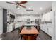 Beautiful, open kitchen with white cabinets, stainless steel appliances, and a central island and breakfast nook at 8341 W Palo Verde Ave, Peoria, AZ 85345