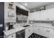 Bright kitchen featuring white cabinetry, stainless steel appliances, and a breakfast nook at 8341 W Palo Verde Ave, Peoria, AZ 85345