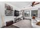 Bright living room with modern decor and large screen television at 8341 W Palo Verde Ave, Peoria, AZ 85345