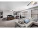 Open loft space with a sofa, desk, and recreational area, perfect for relaxing or working at 8341 W Palo Verde Ave, Peoria, AZ 85345