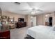 Spacious main bedroom with carpet floors, ceiling fan and access to a walk-in closet at 8341 W Palo Verde Ave, Peoria, AZ 85345