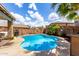 Backyard featuring a private pool, tropical plants, a barbecue area, perfect for outdoor entertainment at 8341 W Palo Verde Ave, Peoria, AZ 85345