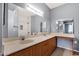 Bright bathroom with dual sinks and a subway-tiled shower/tub combo at 10136 E Southern Ave # 1074, Mesa, AZ 85209