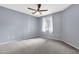 Cozy bedroom with ceiling fan, neutral paint, and plush carpeting at 10136 E Southern Ave # 1074, Mesa, AZ 85209