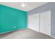 Bedroom featuring two-tone walls, carpet floors, a ceiling fan, and closet at 10136 E Southern Ave # 1074, Mesa, AZ 85209