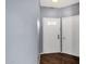 Interior view of the entryway featuring a white door and wood-look flooring at 10136 E Southern Ave # 1074, Mesa, AZ 85209