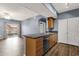 Kitchen with stainless steel appliances, wood cabinets, and a view into the living area at 10136 E Southern Ave # 1074, Mesa, AZ 85209
