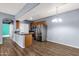 A modern kitchen featuring stainless steel appliances, wood cabinets, and a breakfast bar at 10136 E Southern Ave # 1074, Mesa, AZ 85209
