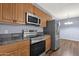 Modern kitchen features stainless steel appliances and granite countertops at 10136 E Southern Ave # 1074, Mesa, AZ 85209