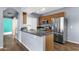 Modern kitchen features stainless steel appliances, granite countertops, and wood cabinets at 10136 E Southern Ave # 1074, Mesa, AZ 85209