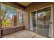 Exterior view of a patio with a sliding glass door and view of the neighborhood at 10136 E Southern Ave # 1074, Mesa, AZ 85209