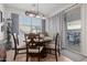 Charming dining area with a round table, stylish chairs, and sliding glass doors to the patio at 10138 W Wood St, Tolleson, AZ 85353