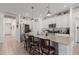 Bright kitchen with white cabinets, stainless steel appliances, and a large center island at 10138 W Wood St, Tolleson, AZ 85353