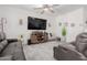 Cozy living room with a large TV, wooden entertainment center, and comfortable seating at 10138 W Wood St, Tolleson, AZ 85353