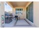 Covered patio featuring a built in grill and sliding glass door at 10138 W Wood St, Tolleson, AZ 85353
