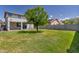 Spacious backyard offers ample green space, perfect for outdoor activities and enjoying the sunshine at 10221 W Puget Ave, Peoria, AZ 85345
