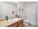 Bright bathroom with tan counter, neutral colors, shower, and sink at 10221 W Puget Ave, Peoria, AZ 85345