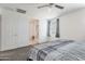 Bedroom boasts soft carpet, natural light, and ensuite bathroom at 10221 W Puget Ave, Peoria, AZ 85345