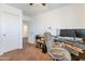 Comfortable bedroom with desk and chair alongside work space and carpeted floors at 10221 W Puget Ave, Peoria, AZ 85345