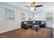 Upstairs bonus room with large windows and gray sofa with throw pillows at 10221 W Puget Ave, Peoria, AZ 85345