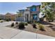 Inviting two-story home boasting a well-manicured front yard with lush greenery and ample parking space in a driveway at 10221 W Puget Ave, Peoria, AZ 85345