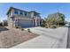 Spacious two-story home with a wide driveway and desert landscaping, nestled in a quiet residential street at 10221 W Puget Ave, Peoria, AZ 85345