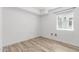 A finished basement with a window for natural light and stylish wood-look flooring at 1038 N 78Th Pl, Scottsdale, AZ 85257