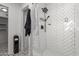 Bathroom with a walk-in shower and white herringbone tile at 1038 N 78Th Pl, Scottsdale, AZ 85257