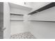 Walk-in closet with tile floors and shelves at 1038 N 78Th Pl, Scottsdale, AZ 85257