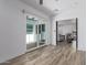 Open floor plan with sliding glass doors, wood-look flooring and view of living area at 1038 N 78Th Pl, Scottsdale, AZ 85257